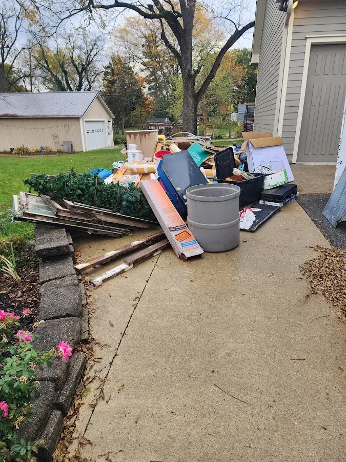 Dumpster being loaded with debris for Roofing Dumpster Rental in Ojai